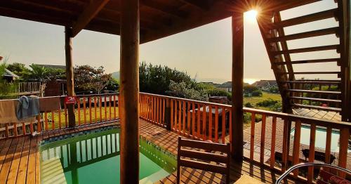 a view of a swimming pool on a deck at Baleia Azul - House 7A in Ponta Mamoli