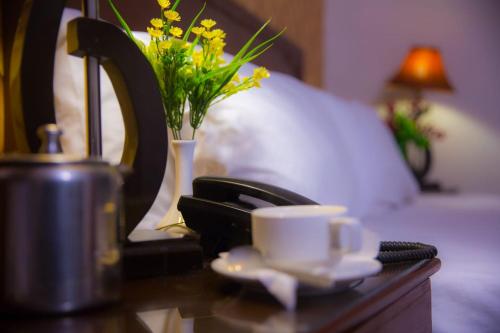 Postel nebo postele na pokoji v ubytování New Chancery Hotel 77-k