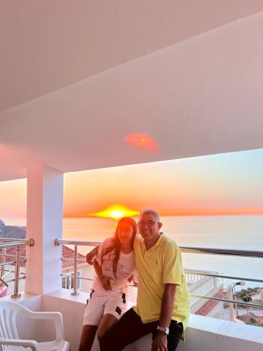 a man and woman posing for a picture in a house at Apartamento con vistas al mar 3 in Al Hoceïma