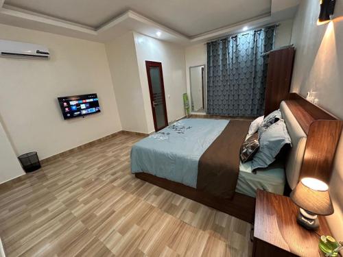 En eller flere senge i et værelse på Les Résidences Aya Et Fils 1