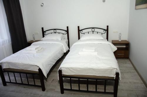 Ein Bett oder Betten in einem Zimmer der Unterkunft D&T Hotel
