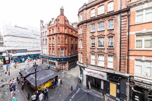 an overhead view of a city street with buildings at Private Room in Quirky Soho in London