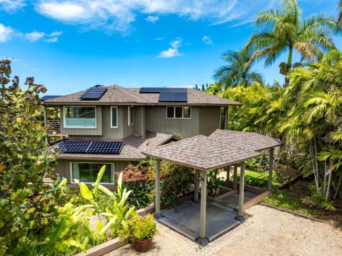 a house with solar panels on the roof at Hanalei Plantation home in Princeville