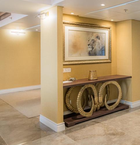 a room with a lion picture on the wall at Rainbow Towers Hotel & Conference Centre in Harare