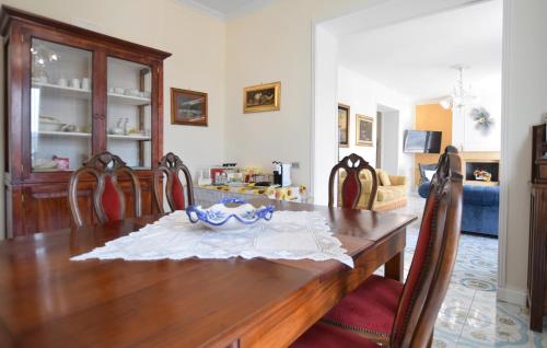 a dining room with a wooden table and chairs at Amazing Home In Giungano With Wifi in Giungano