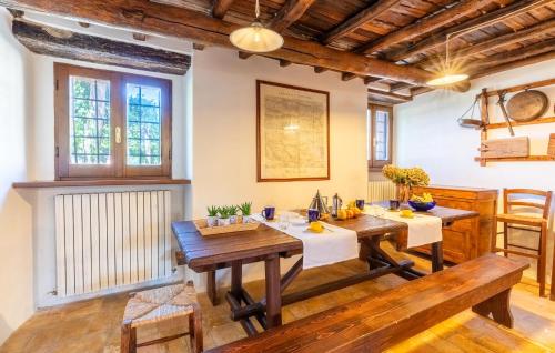 a dining room with wooden tables and a radiator at Cozy Home In Spoleto With Wifi in Spoleto