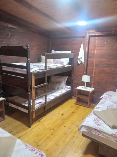 a room with two bunk beds and a lamp at Vanilla in Gornji Štoj