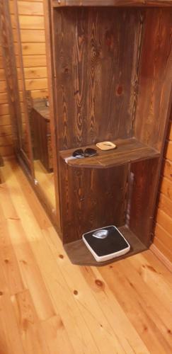a wooden room with a table with a laptop on it at wooden villa in Mardakan