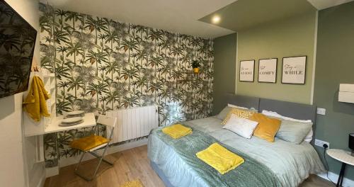a bedroom with a bed with yellow pillows at Market Dream King Bed, Deluxe Town Centre Studio in Northampton