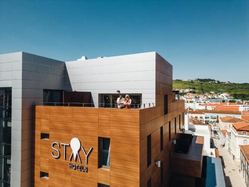 a group of people standing on top of a building at Stay Hotel Torres Vedras Centro in Torres Vedras