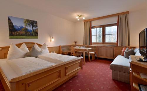 Posteľ alebo postele v izbe v ubytovaní Gästehaus Brantlhof Zimmer und Ferienwohnungen in Going am Wilden Kaiser