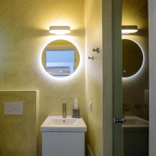 a bathroom with a sink and a mirror at Elia Pyrgos in Pyrgos