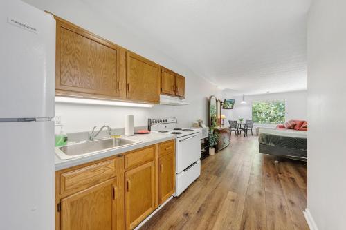 a kitchen with a sink and a stove top oven at Halesford Harbour Resort - Smith Mountain Lake in Moneta