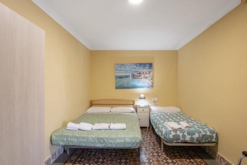 Ένα ή περισσότερα κρεβάτια σε δωμάτιο στο Masia Cal Vies