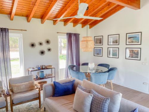 a living room with a couch and a table at Monte dos Pinheiros in São Teotónio