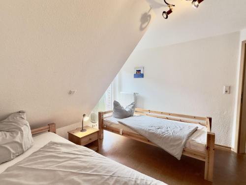 Ένα ή περισσότερα κρεβάτια σε δωμάτιο στο Haus Jany - Harlesiel