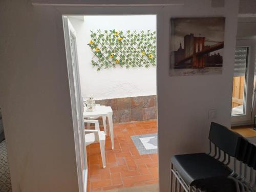 a view of a room with a table and a window at Casa Maranaty in Vejer de la Frontera