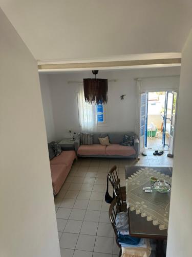 a living room with a couch and a table at Family Apartment in Potamos Kythira in Potamós