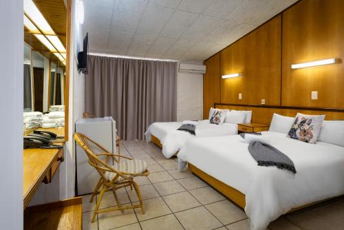 Katil atau katil-katil dalam bilik di Merino Inn Hotel