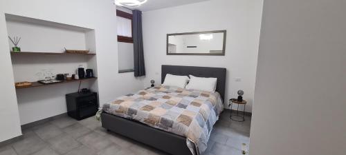 Una cama o camas en una habitación de Affittacamere Faet