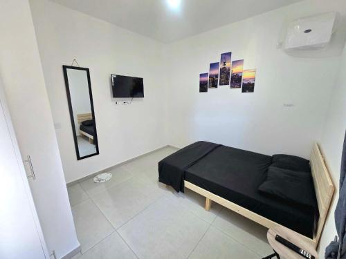 Una televisión o centro de entretenimiento en EilatCasa