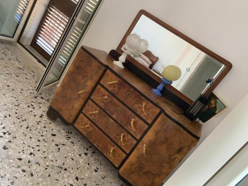 a dresser with a mirror on top of it at Bed & Breakfast StudioArcodia- in San Marco dʼAlunzio