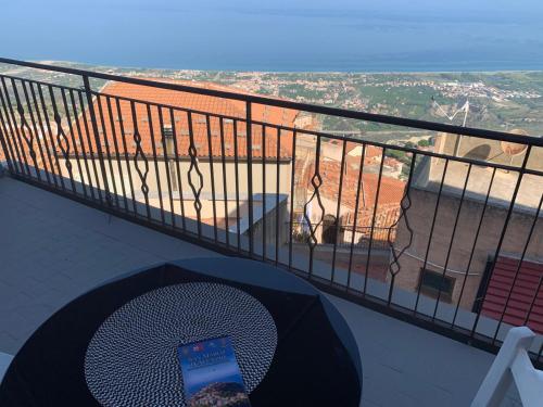 a cell phone sitting on a table on a balcony at Bed & Breakfast StudioArcodia- in San Marco dʼAlunzio
