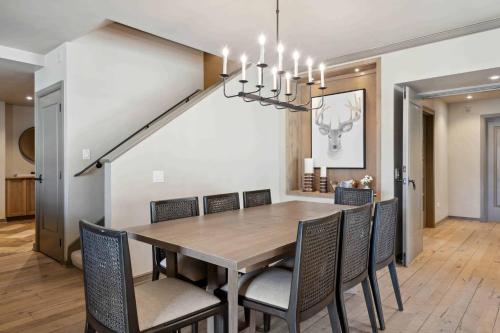 a dining room with a table and chairs at Village Hall 09 by East West Hospitality in Beaver Creek