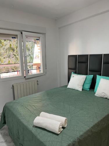 Ένα ή περισσότερα κρεβάτια σε δωμάτιο στο Aparment villaverde