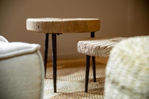 a stool and two chairs in a room at BTFL Living Antwerp in Antwerp