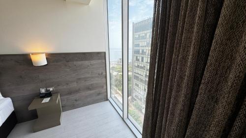 a room with a large window in a hotel room at Best Western Plus Urban Larco Hotel in Lima