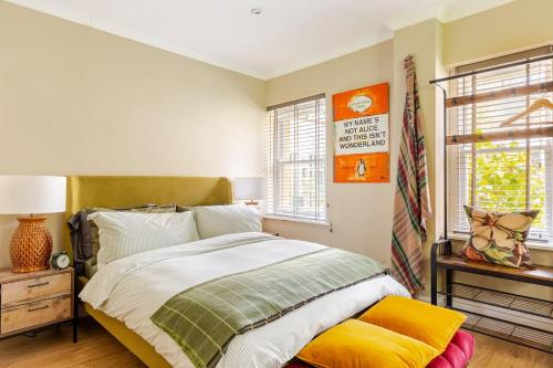 a bedroom with a bed and a window at Spacious Country Cottage Sleeps 7 Near Bath Fire Pit Dog Friendly in Bradford on Avon
