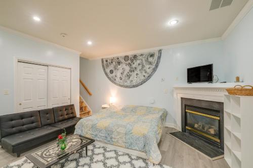 a bedroom with a bed and a fireplace at Day Trip to DC - Sterling Studio with Pool Access in Sterling