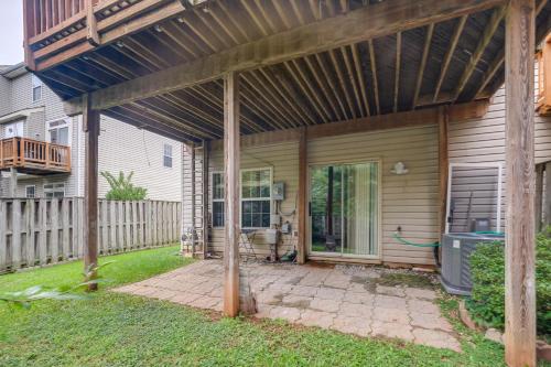 an outdoor patio with a wooden pergola at Day Trip to DC - Sterling Studio with Pool Access in Sterling