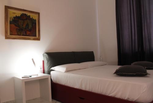 Ein Bett oder Betten in einem Zimmer der Unterkunft FALSTAFF Rooms & Suites