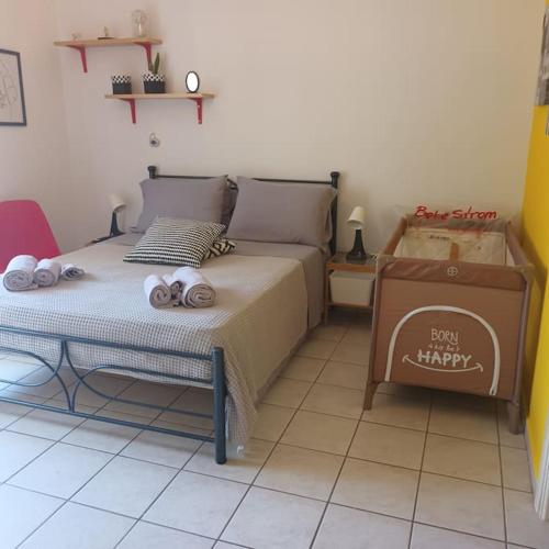 a bedroom with a bed with two stuffed animals on it at Stelios apartment 1 in Chios