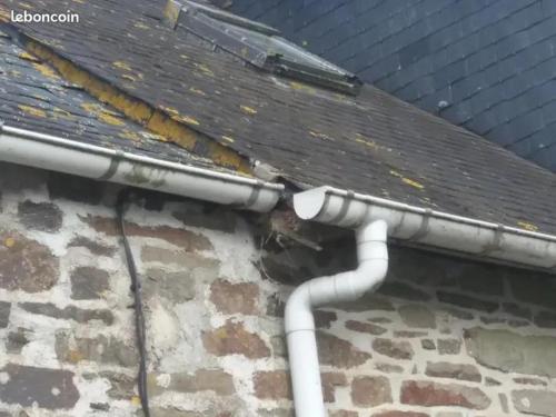 a leaking roof with pipes on a building at Argoat in Locarn
