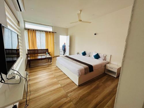 Ένα ή περισσότερα κρεβάτια σε δωμάτιο στο WM Resorts