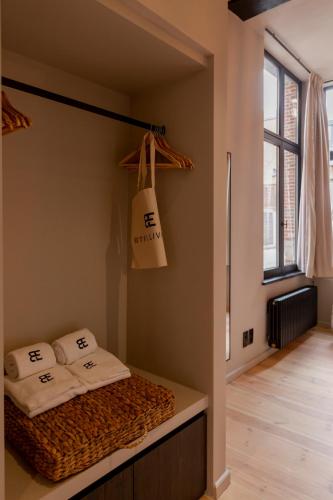 a room with a bed with two pillows on it at BTFL Living Antwerp in Antwerp