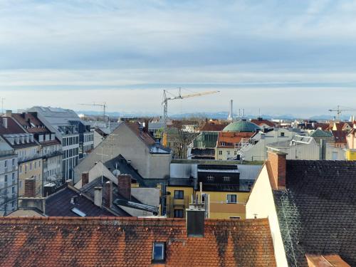 a view of a city with roofs and buildings at Modern City Apartment 1 in Munich