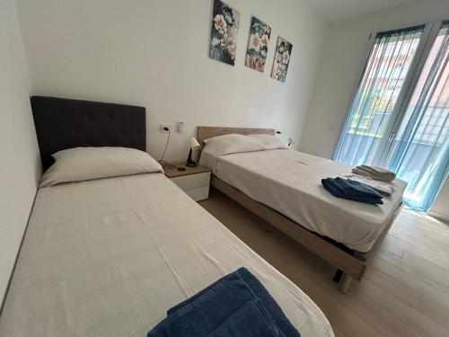 Postel nebo postele na pokoji v ubytování Borromini apt Como-Cernobbio