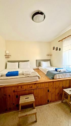 two beds sitting next to each other in a bedroom at Sea House Lahania in Lachania