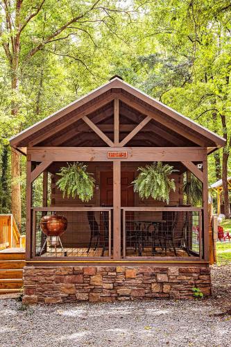 a gazebo with a table and chairs in it at Pops Cabin Lookout Mountain Luxury Tiny Home in Chattanooga