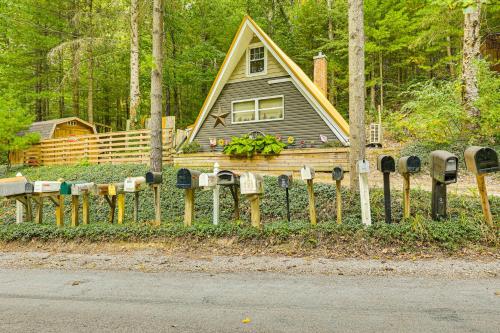 a house with a bunch of parking meters in front of it at Carrollton Cabin with Patio and Fire Pit! in Carrollton