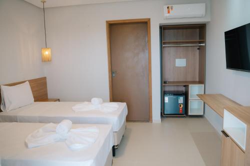 Postel nebo postele na pokoji v ubytování Oiti Beach Resort Tutoia