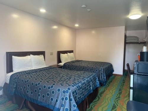 Postel nebo postele na pokoji v ubytování Atlantic Motel