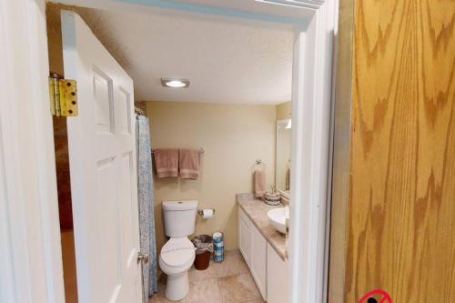 a bathroom with a toilet and a sink at Majestic Studio Pool-Spa Ski-in out Gym, Sauna, Laundry, BBQ in Brian Head