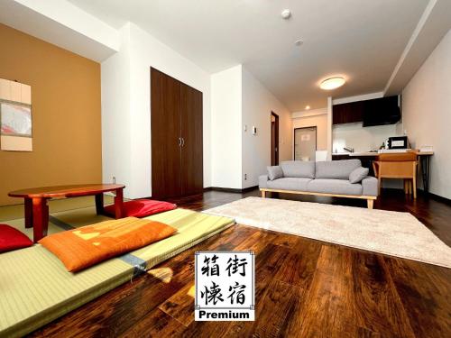 a living room with a couch and a table at Hakodatekan - Vacation STAY 07877v in Hakodate