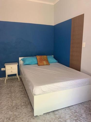 Ένα ή περισσότερα κρεβάτια σε δωμάτιο στο Cantinho bora praia Boraceia