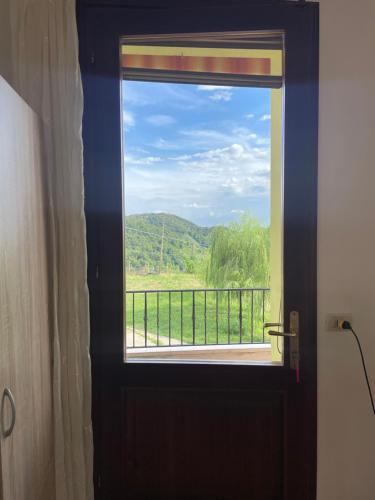 a window with a view of a mountain view at Silvia Miotto's Guesthouse in Guia